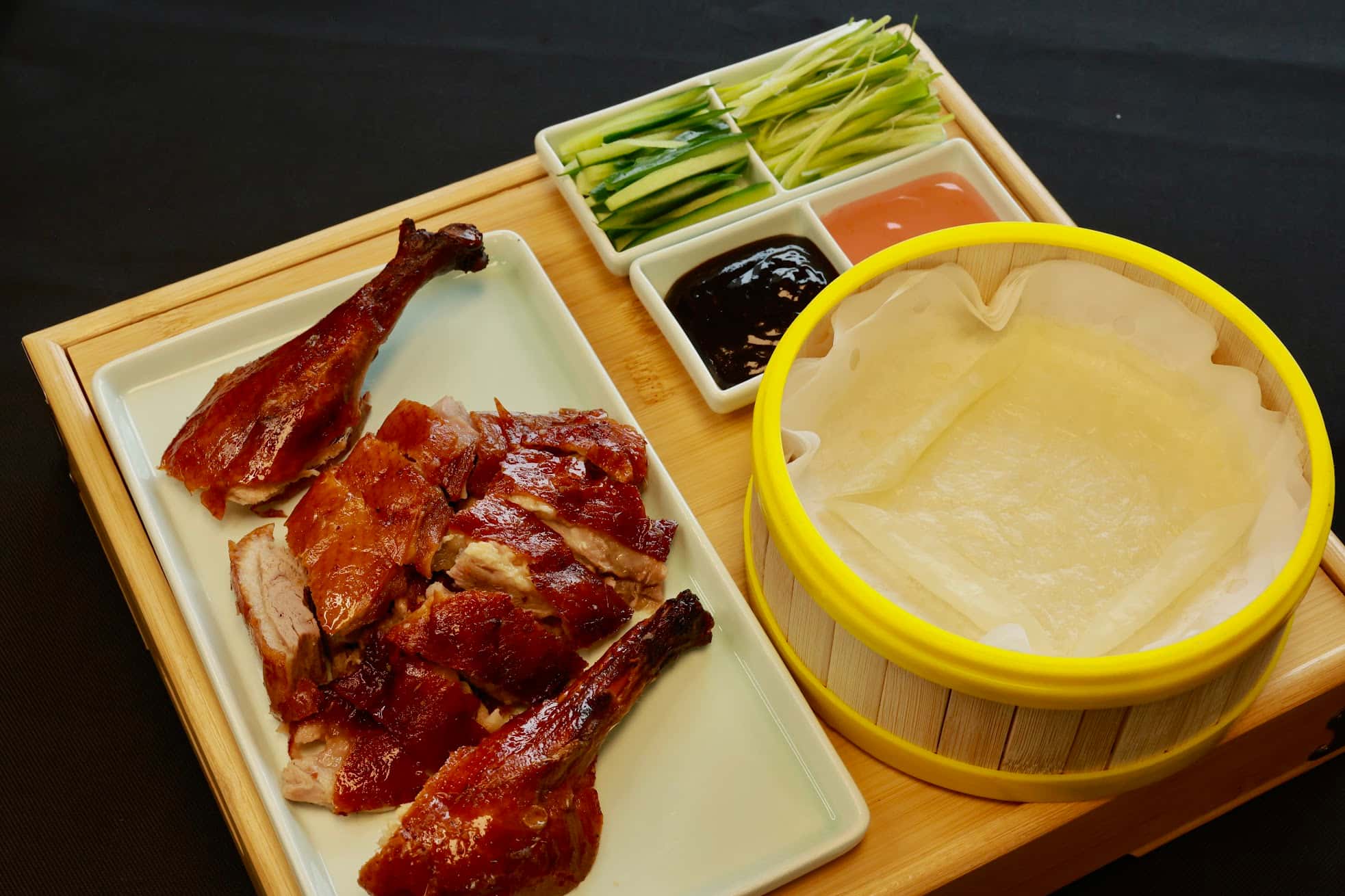 Bao-House-Chinese-Restaurant-Peking-Duck-Stillwater Roasted Peking duck served with pancakes and sauces at Bao House, a Chinese Restaurant in Stillwater