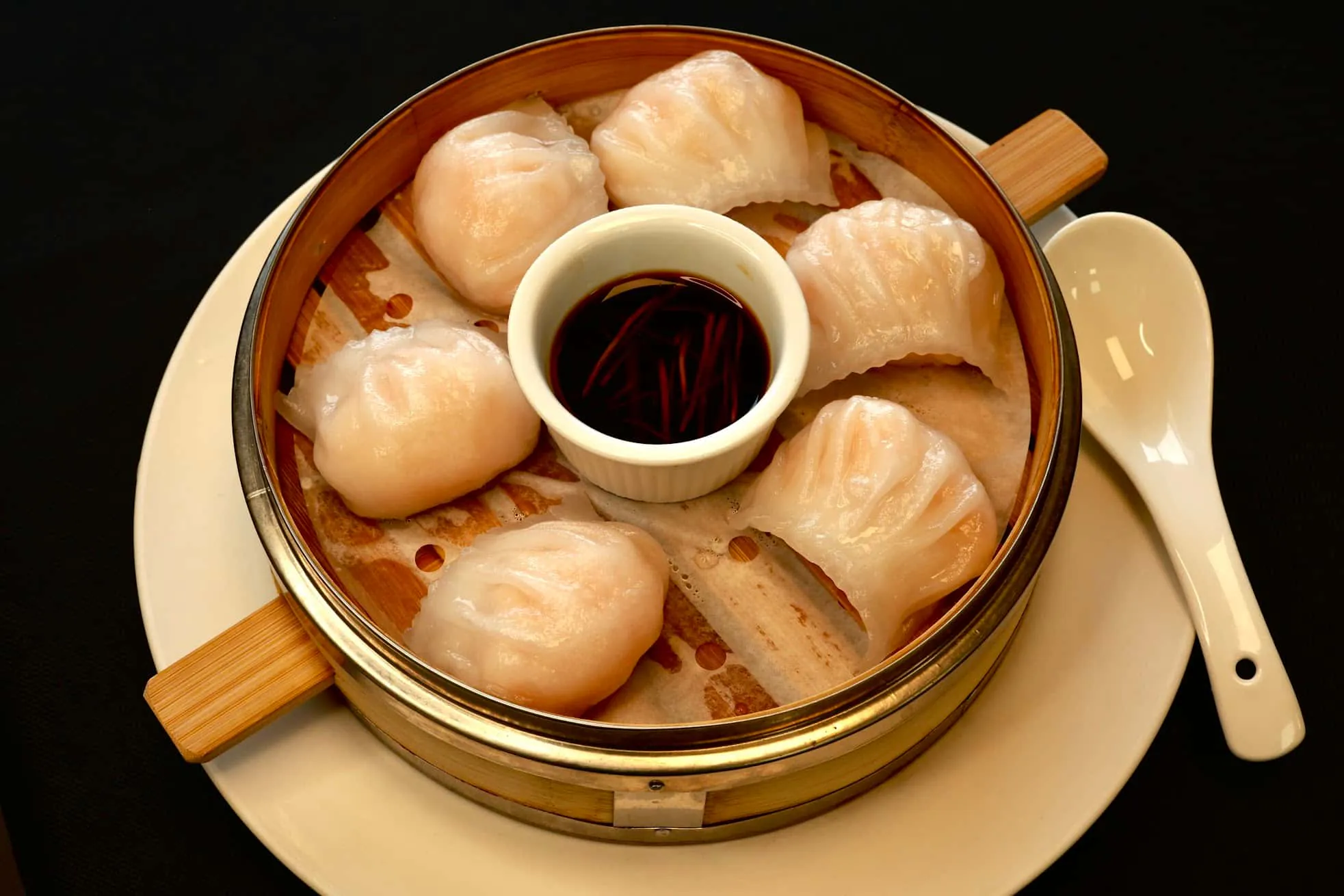 Steamed shrimp dumplings served with soy sauce at Bao House, a Chinese Restaurant in Stillwater