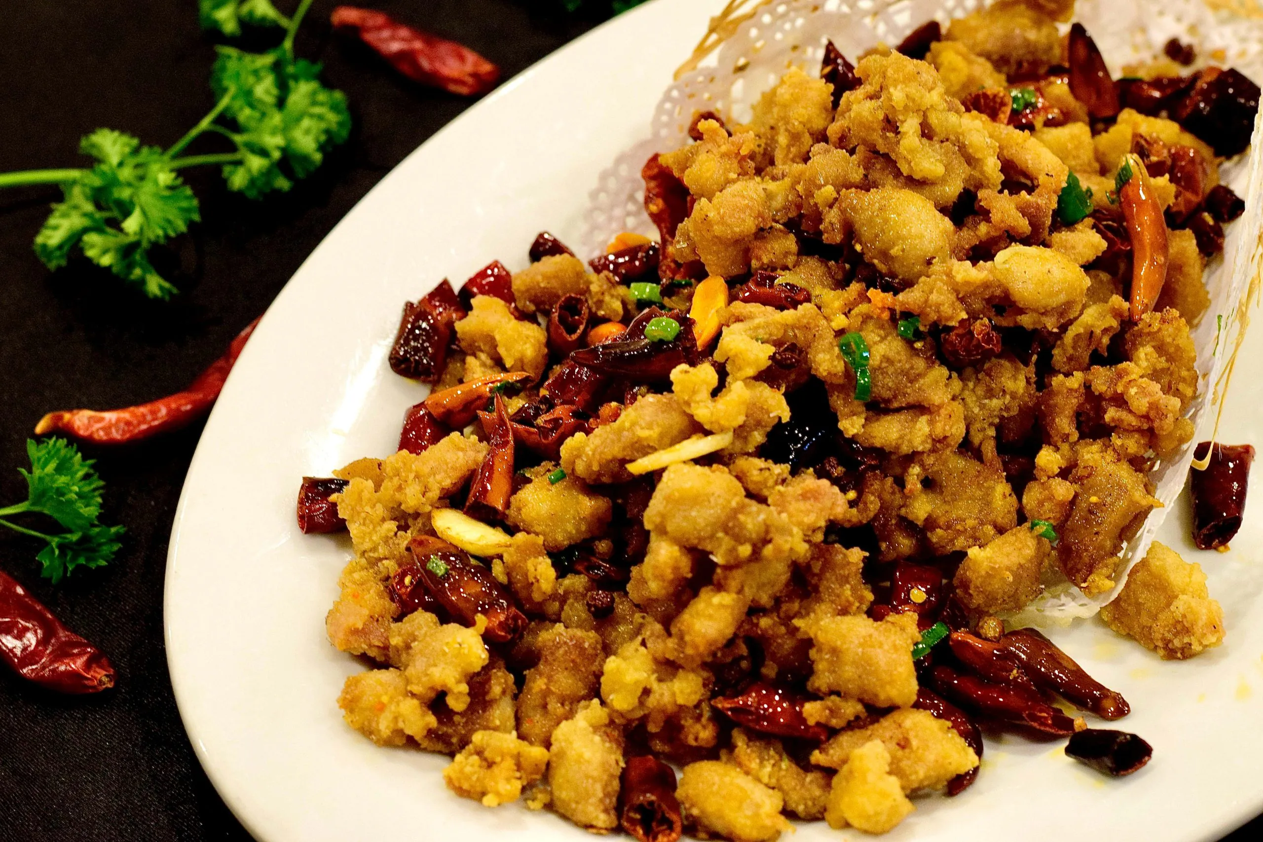 Spicy fried chicken dices with chilies and cauliflower at Bao House, a Chinese Restaurant in Stillwater